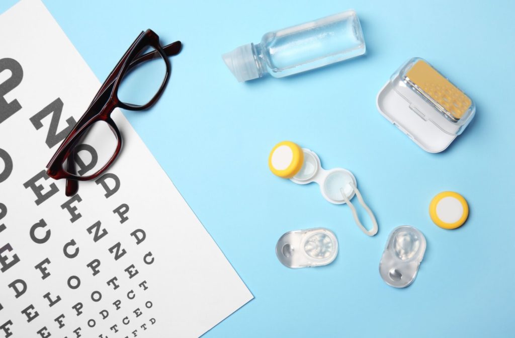 A visual eye exam, glasses and contact lenses are on a blue background.